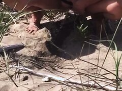 Shaved MILF Pees At The Beach
