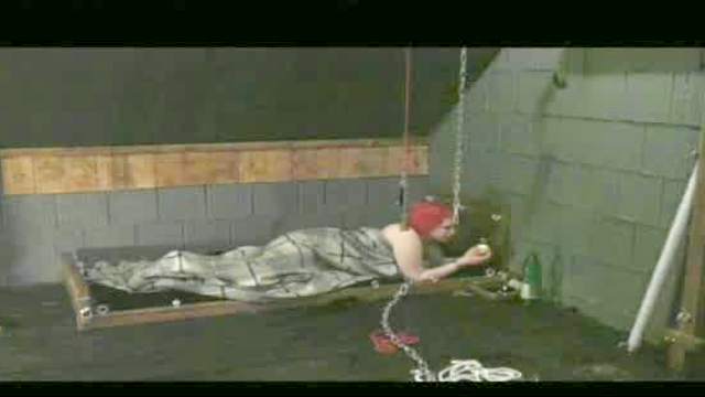 Redhead Sleeps Tied Up In The Dungeon
